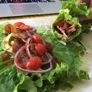 Lettuce wrapped around cream cheese, avocado, bacon, tomato, red onion, Frank's hot sauce, salt & pepper. 
