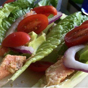 Romaine Lettuce stuffed with leftover cold wild coho salmon (baked with garlic & ginger), avocado, red onion, & tomato. 